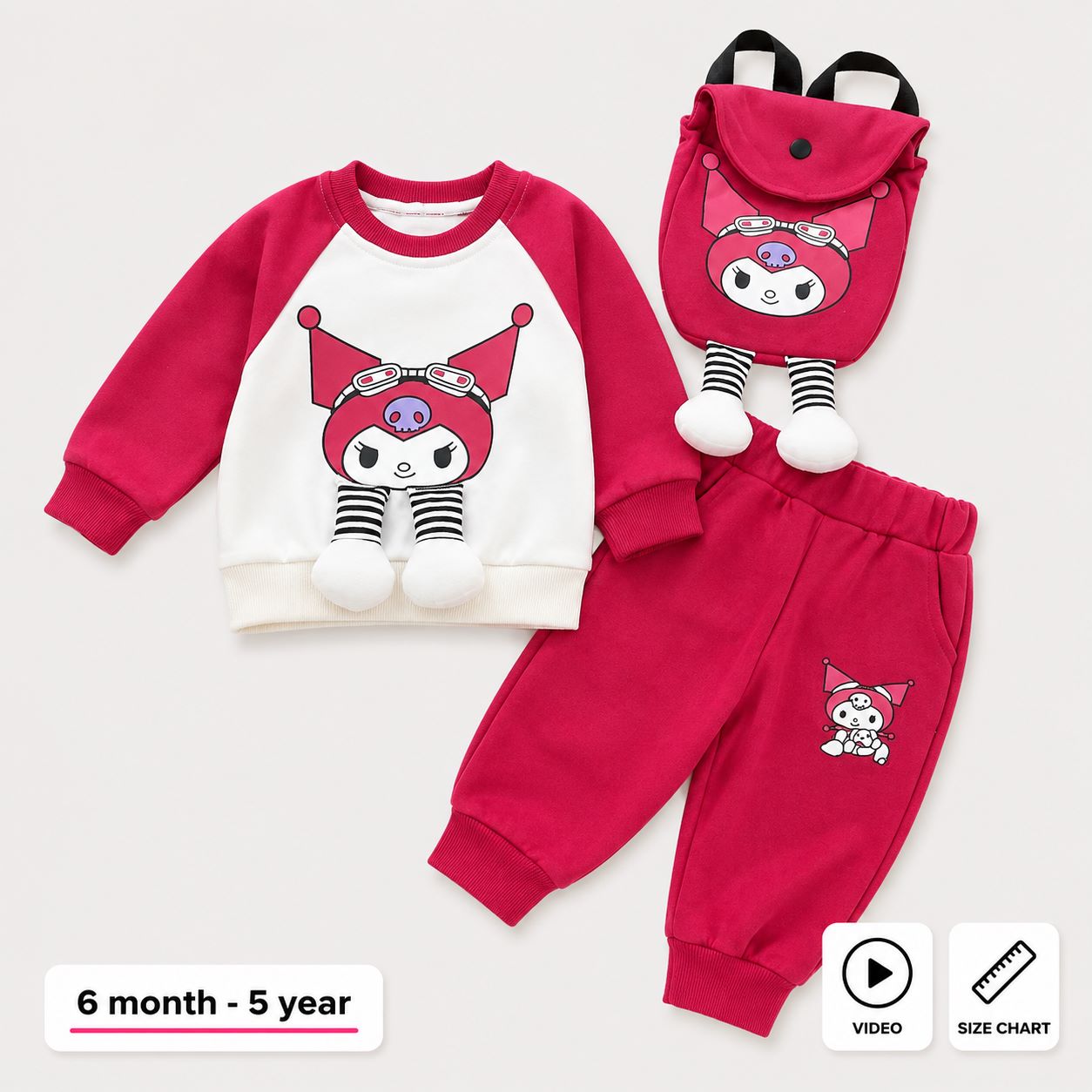 A children's three-piece outfit set featuring a long-sleeve raglan sweatshirt, matching jogger pants, and a small backpack, all in a bright pink and white color scheme with cartoon character graphics. The background is a clean, light off-white studio setting.