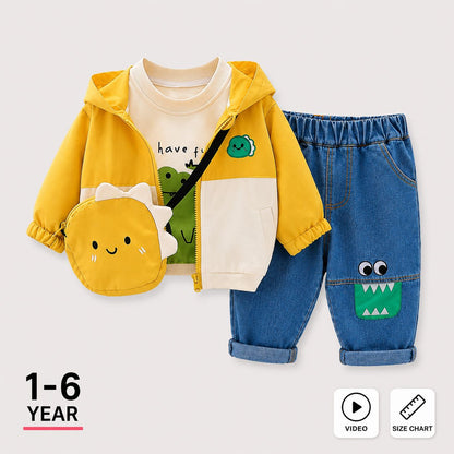 A children's outfit set featuring a yellow hooded zip jacket over a cream graphic shirt, blue denim pants with a green monster patch, and a matching yellow dinosaur-shaped crossbody bag, shown on a light gray background with '1-6 YEAR' and video/size chart icons.