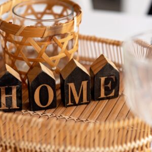 Still life home decor in a cozy home with wooden letters saying home.