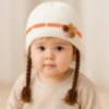 Knitted Woolen Cap with Braided Hair (12- 36M) - Floral Patch - Soft & Warm white how it looks